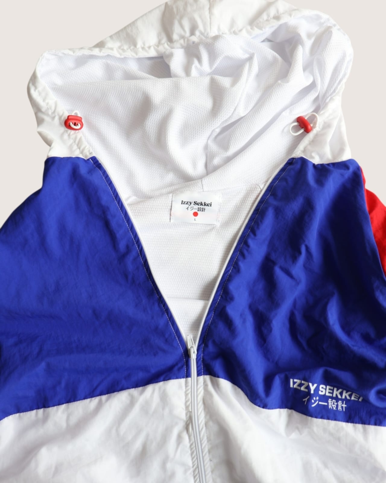 IZZY SEKKEI ZIP UP WINDBREAKER