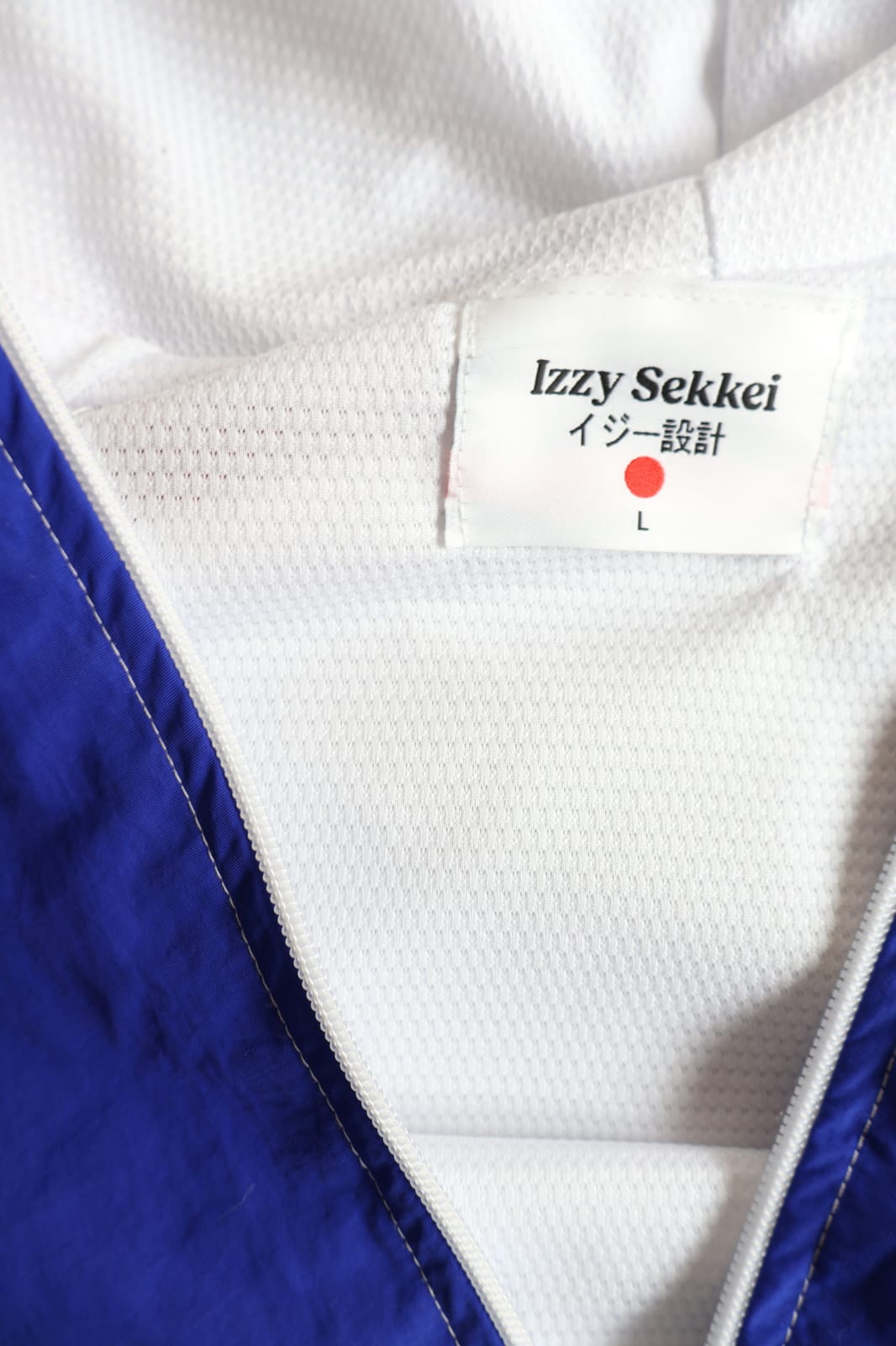 IZZY SEKKEI ZIP UP WINDBREAKER